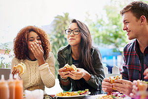 friends laughing over a meal out