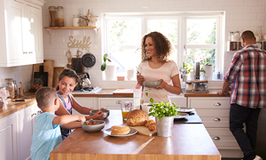 family enjoying breakfast at home