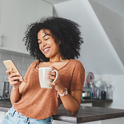 Mid Oregon Credit Union Social Media Statement  |  Picture of woman using her phone to access social media 